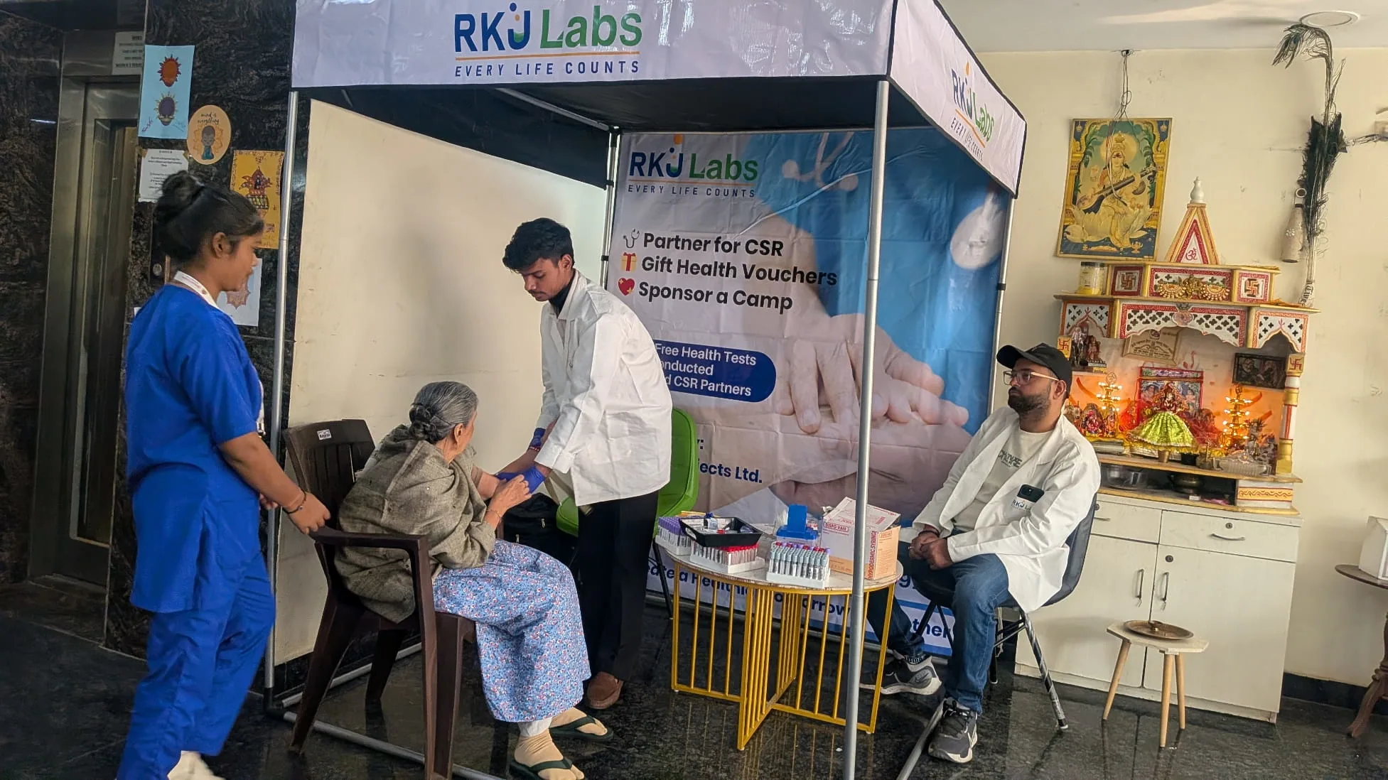Nurse caring for a tracheostomy patient at home in Delhi